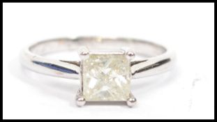 A white gold single stone diamond ring. Princess cut, the diamond approx 75pnts complete in the