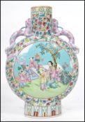 A 19th century Oriental Chinese ceramic moon flask having pink dragon handles and painted