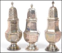 A set of three silver hallmarked pepperette's / sifters of hexagonal form raised on circular