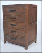 An early 20th century bachelors chest of drawers comprising a bank of five drawers and raised  on