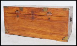 A 19th century Anglo-Indian camphor wood blanket box chest coffer of rectangular form with brass