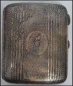 An early 20th century Edwardian silver hallmarked cheroot case having an engine turned design with