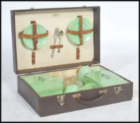 A collection of 3x large vintage suitcases to include; case with 'E.B.' embossed to front, miniature