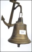 A vintage 20th century cast iron ships bell with notation for MS Bremien 1911 mounted on an anchor