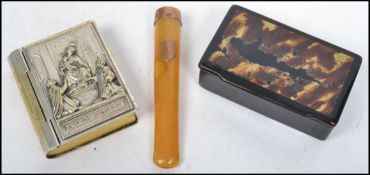 A decorative brass silver plated vesta in the form of a book together with a papier mache 19th
