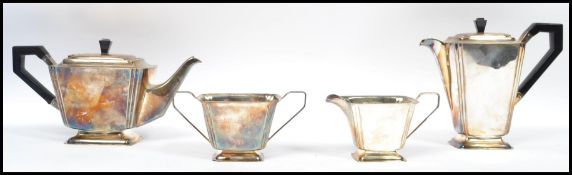 An art deco silver plated tea service of angular form with ebonised handles consisting of teapot ,