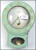A vintage mid 20th century Smiths Enfield bakelite wall clock having an 8 day movement with green