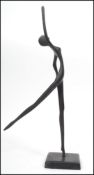 A vintage 20th century Art Deco sculpture of a lady dancer set to a square plinth base. Measures