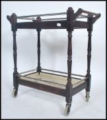 A 20th century two tier tea / service / dinner buffet serving trolley being stained and painted with