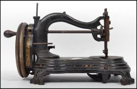 A 19th century Victorian English Wellington sewing machine by Bradbury c1870 having an ebonised body