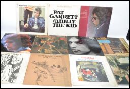 A collection of long play vinyl LP records by Bob Dylan to include Highway 61 Revisited, Pat Garrett