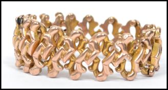 A 9ct gold stamped expanding bracelet of unusual form, weighs 11.8 grams.