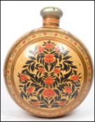 A vintage 20th century large metal moon flask vase the globular body decorated with floral spays and