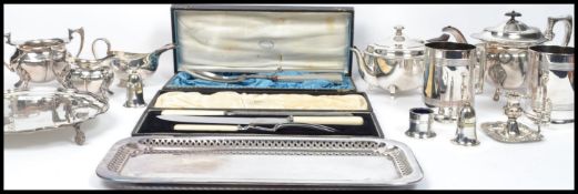 A collection of silver plated items to include a tea set, a pair of Victorian tankards with V R 37