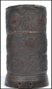 A 19th century Oriental Chinese carved coconut shell brush pot decorated with flowers and medallions
