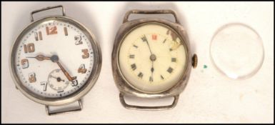2 early 20th century services watches in silver cases, one with Jaeger style face and faceted hands.