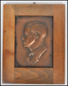 A vintage early 20th century bronze cast plaque of Edward VIII signed G Moussau?. Set within a