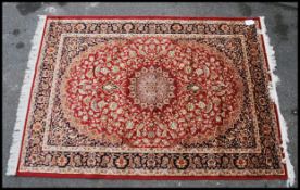 A large Iranian / Persian Keshan carpet - rug having blue and red ground with geometric decoration