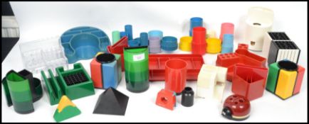 A collection of vintage 20th century retro desk top stationary items to include various stacking,