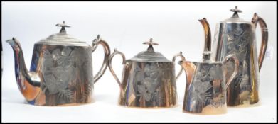 An Edwardian collection of silver plate to include a tea / coffee service comprising coffee pot,