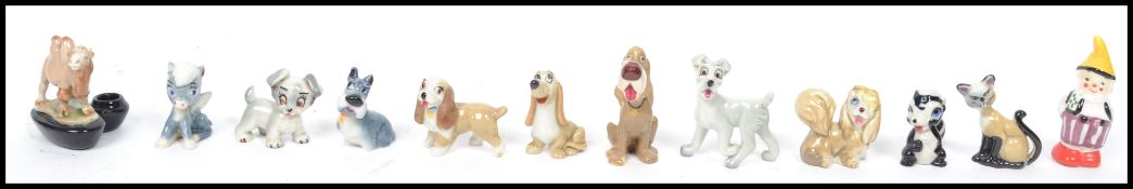A collection of vintage 20th century Wade ceramic Disney figures to include Lady and the Tramp,