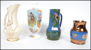 A collection of 19th century jugs to include an unusual blue glaze vase with parrot decoration