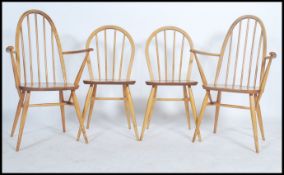 A pair of Ercol Golden Dawn coloured beech and elm framed Windsor, high hoop, spindled back carver