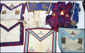 A good group of Masonic Regalia and items to include aprons, sashes, gloves, and cuffs etc. 20