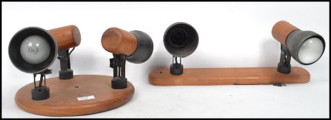 A vintage retro 20th century teak and brass three point ceiling light fixture together with the