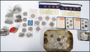A large collection of pre and post decimal coins to include penny sets, 2 pound coins, various