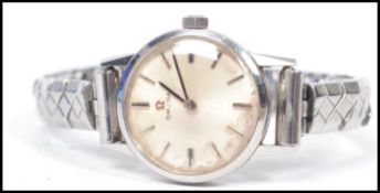 A vintage 20th century ladies Omega cocktail watch set to an expanding bracelet with silvered
