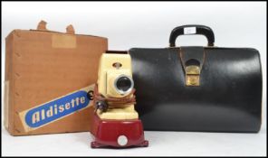 A vintage 20th century boxed two tone Aldisette 3 burgundy and cream slide projector retaining its