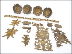 A collection of 19th century ormolu gilt door furnishings to include a gardooned lock and cover,