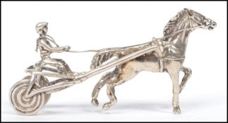 A silver miniature model sculpture of a horse and cart with rider to rear, Weighs 18.7 grams.
