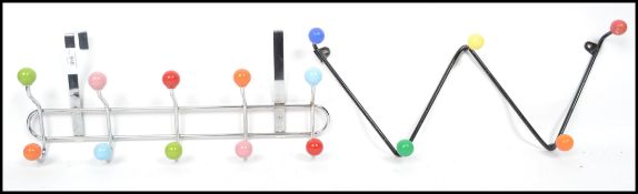 A vintage retro 20th century set of atomic sputnik coat hooks having an ebonised finish and coloured