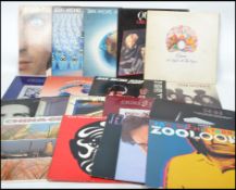 A collection of vintage long play LP vinyl record albums pertaining to Queen, Jean Michel Jarre