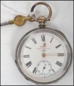 A vintage 20th century Kays Perfection Lever silver pocket watch having a white enamel face with