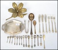 A good collection of silver plated and continental silver flat ware to include berry spoons,