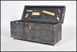 A vintage 20th century ebonised tool box having a