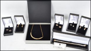 A group of contemporary gilt necklaces, earrings bracelet etc. to include a sterling gilt silver 925