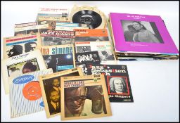 A collection of long pay and EP vinyl jazz records to include Charlie Parker, Bob Thompson, Oscar