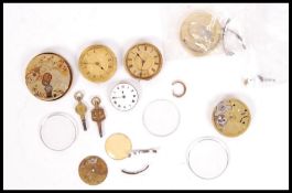 A collection of vintage 19th and 20th century pocket watch movements and spares to include cases