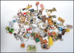 A large collection of vintage 20th century retro key chains to include, Lego, Rubix, Penny Black