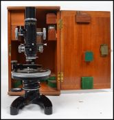 A vintage 20th century Cooke, Troughton & Simms of York microscope with accessories & mahogany