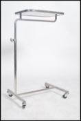 An original mid century Industrial surgeons raised  trolley tray stand of tubular metal and