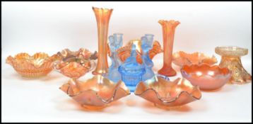 A good collection of 20th century orange lustre carnival glass to include handkerchief bowls, tazza,