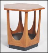 A retro 20th century 1960s teak wood G - Plan teak hexagonal coffee table with inset drop in glass