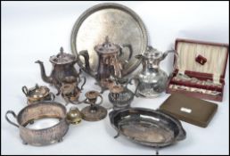 A collection of vintage early 20th century silver plated items to include teapots, creamers, cruets,