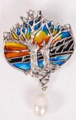 A Silver plique a jour necklace / brooch with glass irridescent back and tress all adorned