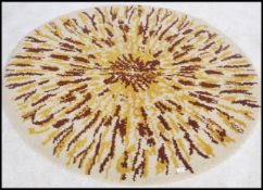 A retro mid century / 1960's circular woollen dyed rug in the manner of Rya.  The wool with